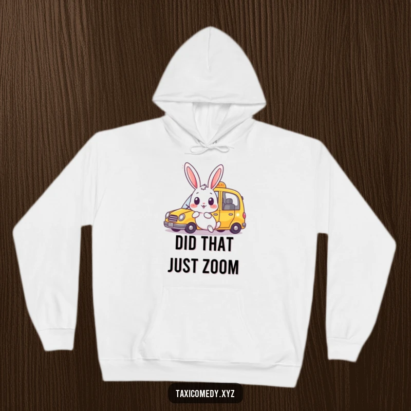 Funny rabbit hoodie featuring a surprised bunny watching a taxi speed by joyfully. Comfortable and humorous apparel.