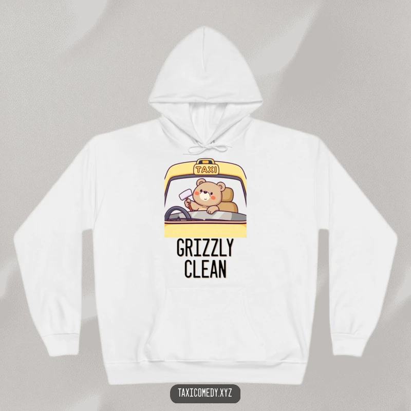 Funny bear character happily polishing a taxi windshield, featured on a cozy hoodie for warmth and cheer.